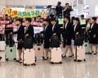‘Tearing down barriers’: North Korean footballers arrive in Seoul for first time in eight years