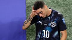 Almiron first player sent off for covering mouth