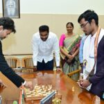 T.N. CM Vijay plays chess with Grandmaster Praggnanandhaa