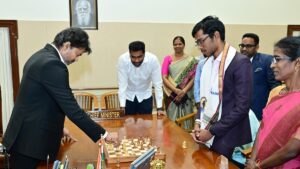 T.N. CM Vijay plays chess with Grandmaster Praggnanandhaa