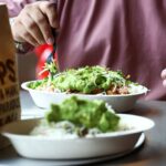 Chipotle hikes same-store sales forecast, says cyclospora fears hit sales in late July