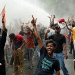 Police crack down on AISA march in Patna seeking resignation of Dharmendra Pradhan
