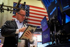 Wall St opens higher as investors weigh earnings; PayPal jumps