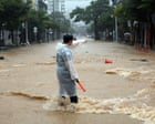 Torrential rains kill one in South Korea while Philippine capital battles major flooding
