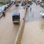 Panathur Railway Underbridge submerged after rain, commuters struggle through hip-deep water